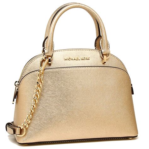 michael kors women's chrwhite and gold|Michael Kors gold purses.